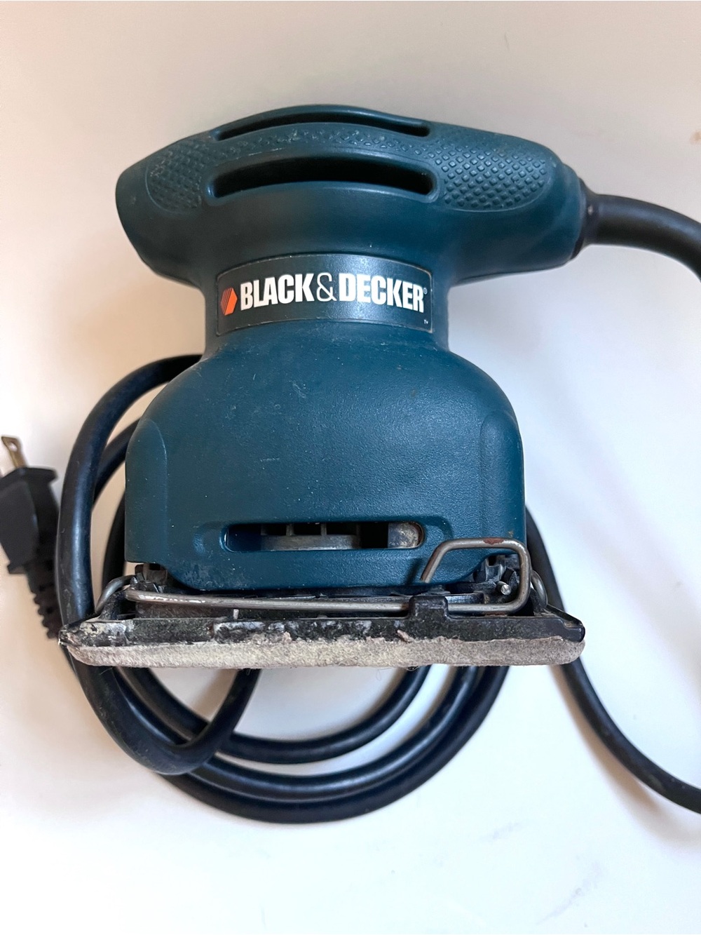 Black & Decker teal palm sander with cord